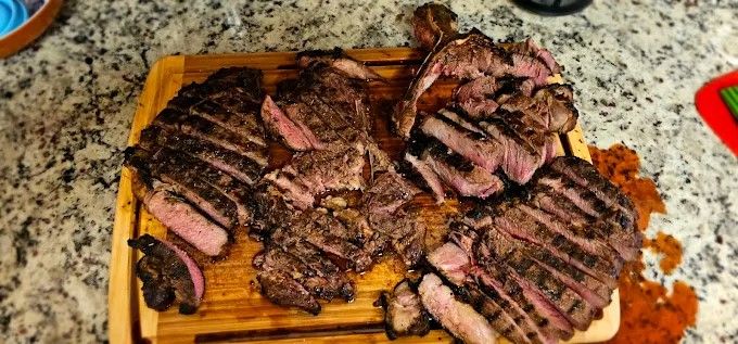 Sliced steaks on a cutting board
