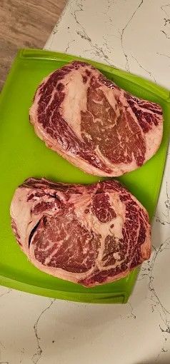 Two ribeye steaks on butcher paper
